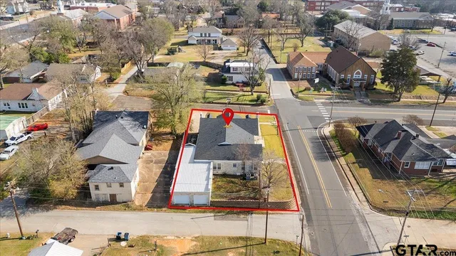 an aerial view of residential houses with outdoor space