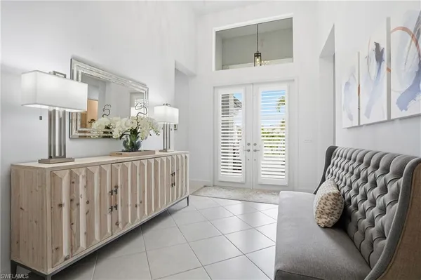 a bedroom with furniture and wooden floor