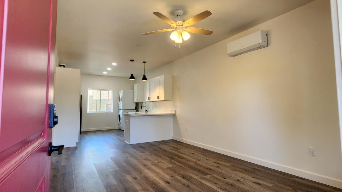 728 West 1st Avenue, Unit 101 Chico, CA 95926 - Photo 2 of 5 a view of workspace with wooden floor and a ceiling fan