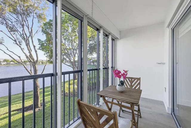 a outdoor dining space with furniture and garden view