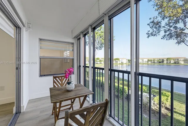 a view of a lake with houses in the back