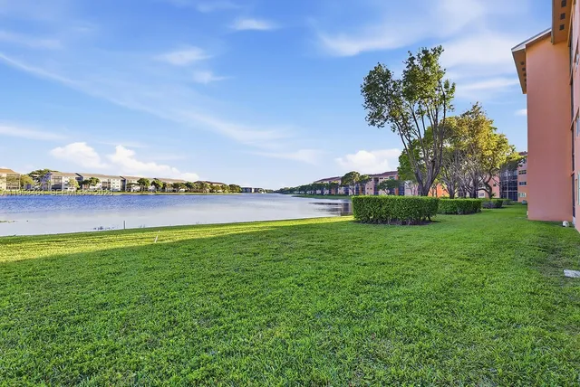 a view of a lake with houses in the back