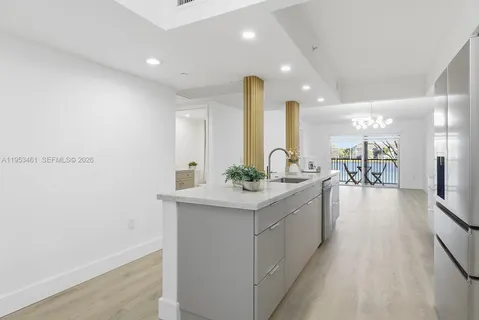 a large kitchen with a lot of counter space and a sink