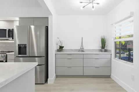 a bathroom with a sink and a large mirror