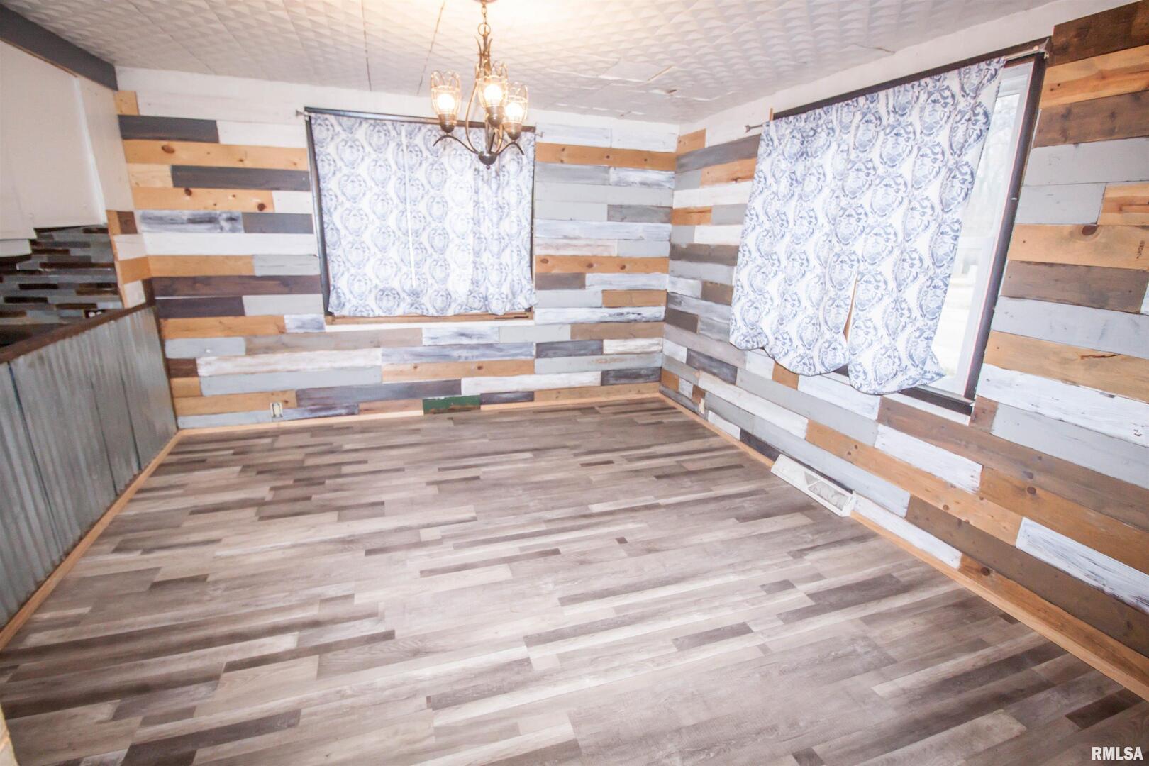 201 North 1st Street Alpha, IL 61413 - Photo 13 of 28 a view of a living room with granite countertop furniture and a fireplace