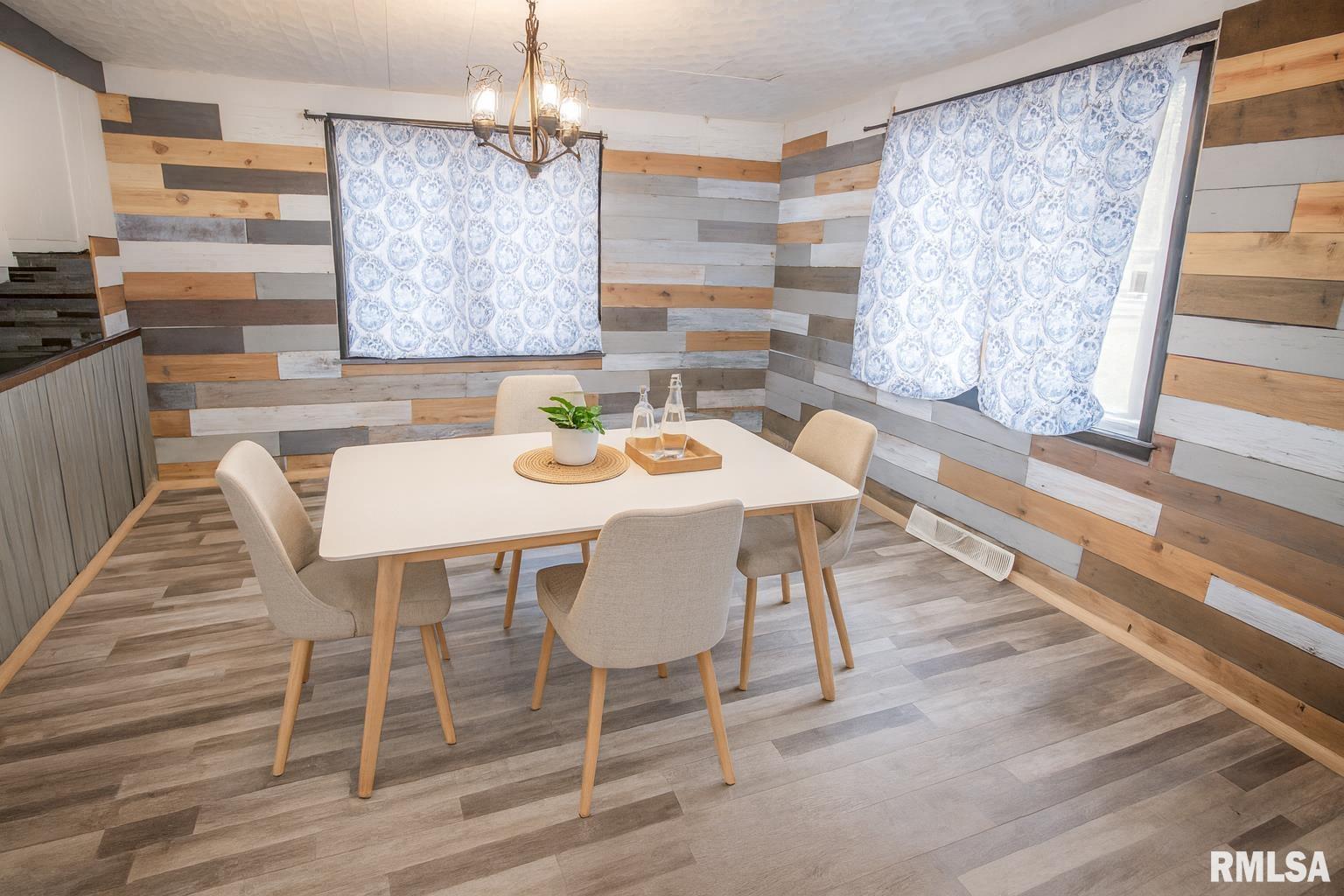 201 North 1st Street Alpha, IL 61413 - Photo 14 of 28 a view of a dining room with furniture window and wooden floor