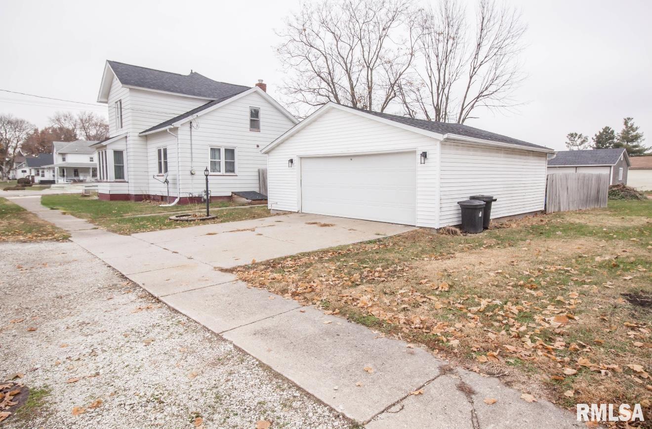 201 North 1st Street Alpha, IL 61413 - Photo 2 of 28 a view of a house with backyard and trees