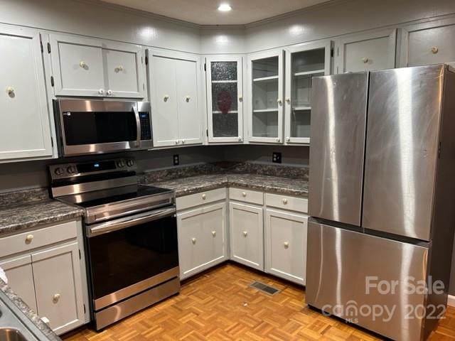 110 Joycetown Church Road Southwest Lenoir, NC 28645 - Photo 19 of 42 a kitchen with stainless steel appliances granite countertop a refrigerator sink and stove