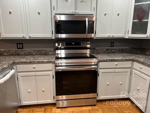 110 Joycetown Church Road Southwest Lenoir, NC 28645 - Photo 21 of 42 a kitchen with stainless steel appliances granite countertop a stove and a microwave