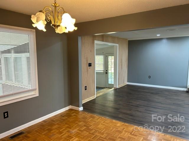 110 Joycetown Church Road Southwest Lenoir, NC 28645 - Photo 22 of 42 a view of an empty room with wooden floor and a window
