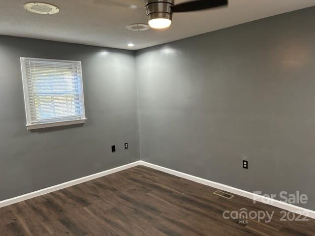 110 Joycetown Church Road Southwest Lenoir, NC 28645 - Photo 24 of 42 an empty room with wooden floor and windows