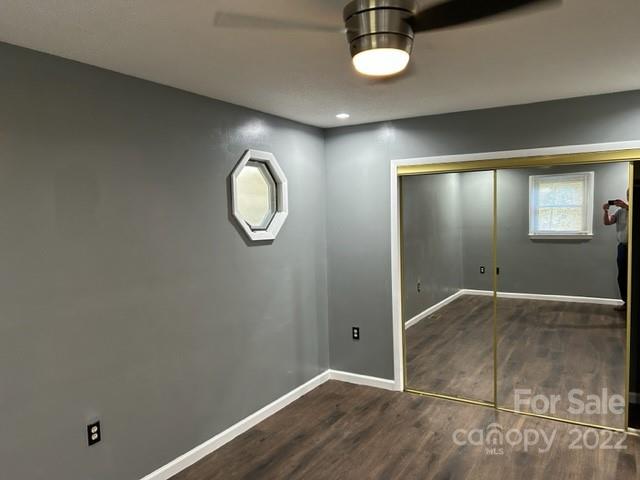 110 Joycetown Church Road Southwest Lenoir, NC 28645 - Photo 25 of 42 an empty room with wooden floor and mirror