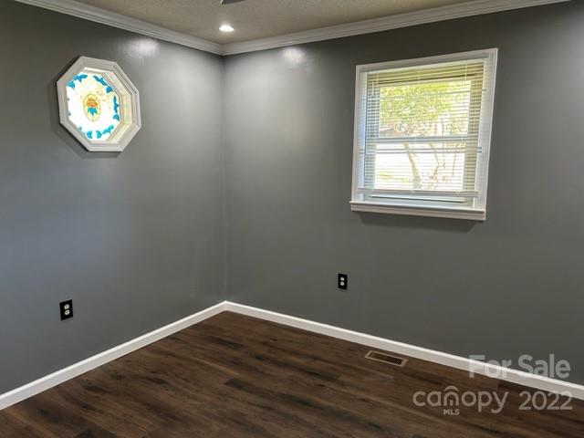 110 Joycetown Church Road Southwest Lenoir, NC 28645 - Photo 28 of 42 an empty room with a wooden floor and a window