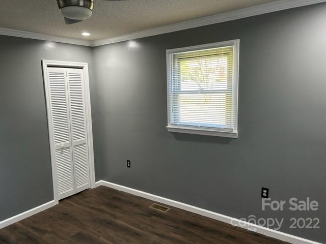 110 Joycetown Church Road Southwest Lenoir, NC 28645 - Photo 31 of 42 an empty room with wooden floor and windows
