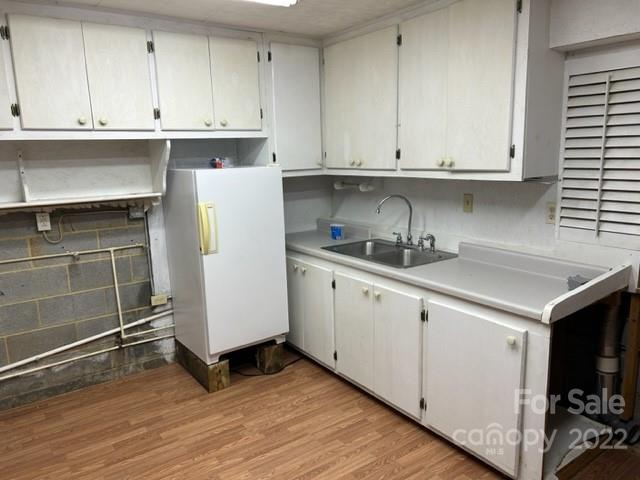 110 Joycetown Church Road Southwest Lenoir, NC 28645 - Photo 38 of 42 a kitchen with granite countertop white cabinets and white appliances