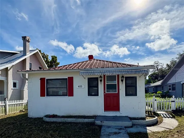 a front view of a house with yard