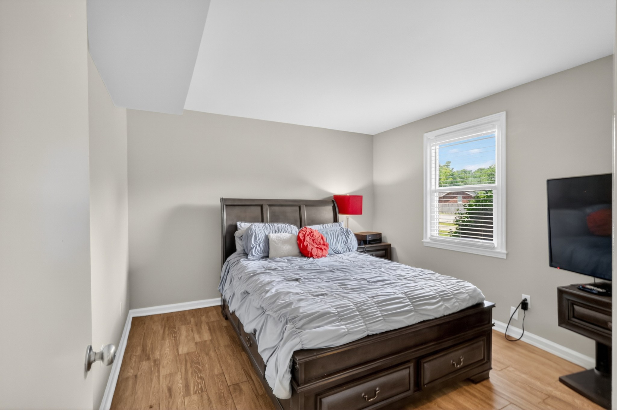 489 Canton Pass Madison, TN 37115 - Photo 21 of 25 a bedroom with a bed and a flat screen tv
