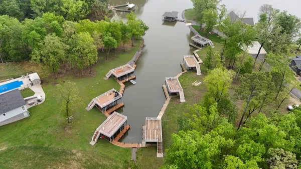an aerial view of a house with outdoor space