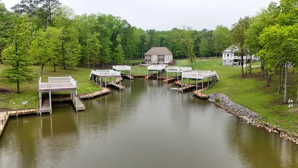 a view of a lake with houses on deck