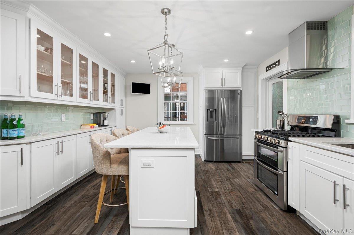 19 Nassau Road Larchmont, NY 10538 - Photo 11 of 40 a kitchen that has a lot of white cabinets and stainless steel appliances