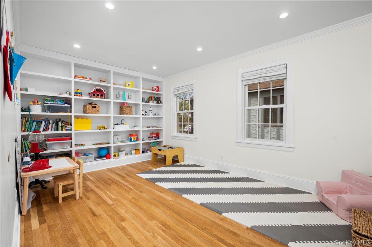 19 Nassau Road Larchmont, NY 10538 - Photo 12 of 40 a living room with furniture and a book shelf