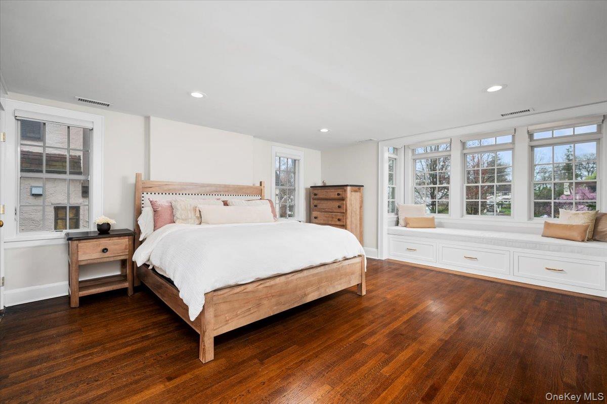 19 Nassau Road Larchmont, NY 10538 - Photo 13 of 40 a bedroom with a large bed and a large window