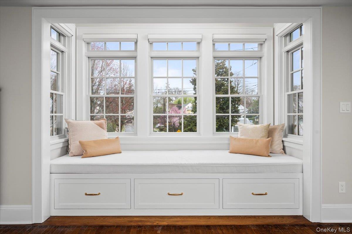 19 Nassau Road Larchmont, NY 10538 - Photo 14 of 40 a living room with a large window and a potted plant