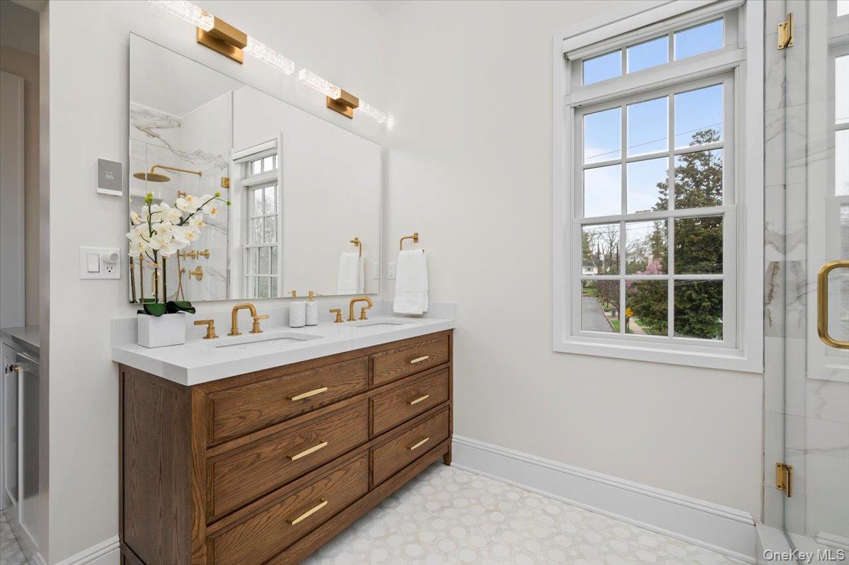 19 Nassau Road Larchmont, NY 10538 - Photo 18 of 40 a bathroom with a sink and a mirror