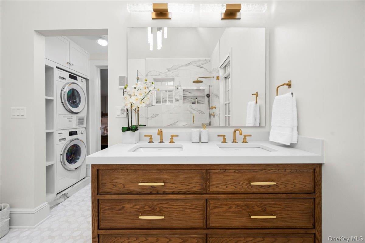19 Nassau Road Larchmont, NY 10538 - Photo 20 of 40 a bathroom with a sink a mirror and shower