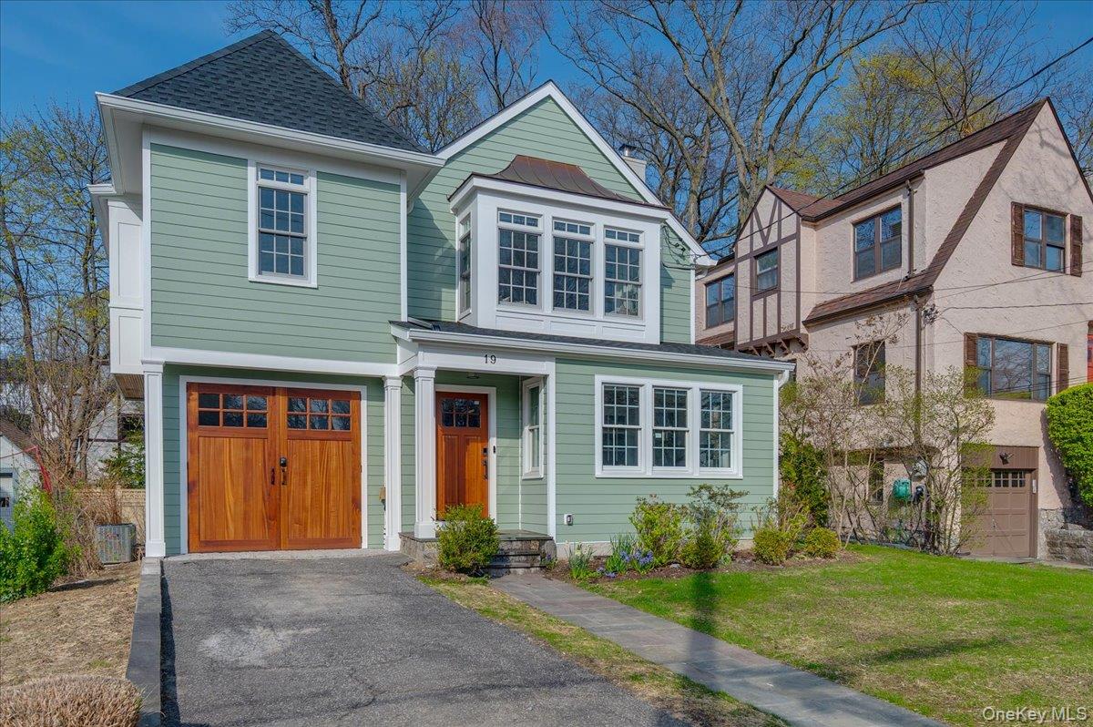 19 Nassau Road Larchmont, NY 10538 - Photo 2 of 40 a front view of a house with garden