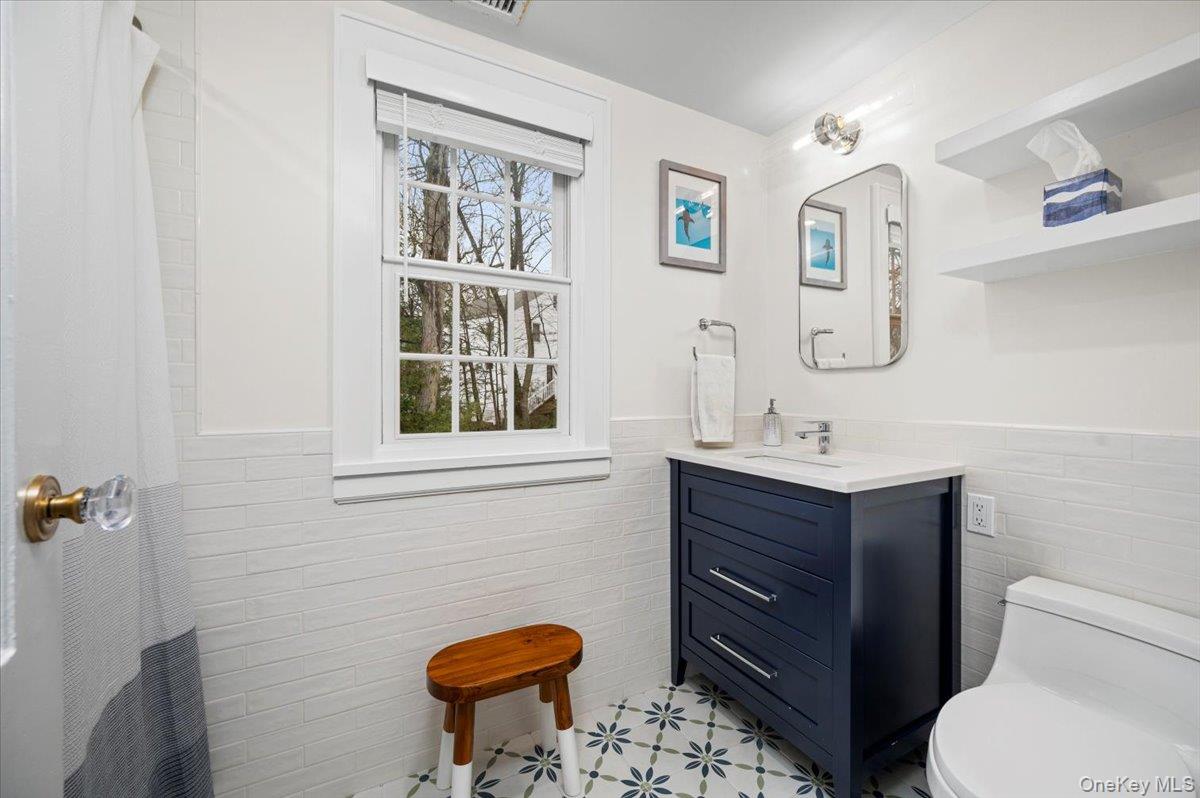 19 Nassau Road Larchmont, NY 10538 - Photo 24 of 40 a bathroom with a toilet sink and mirror