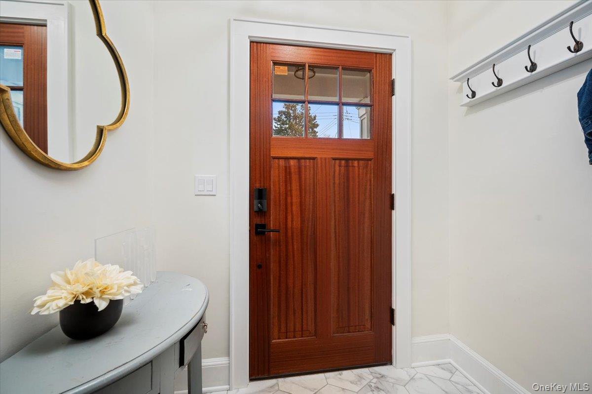 19 Nassau Road Larchmont, NY 10538 - Photo 3 of 40 a view of a bathroom with a sink and a mirror