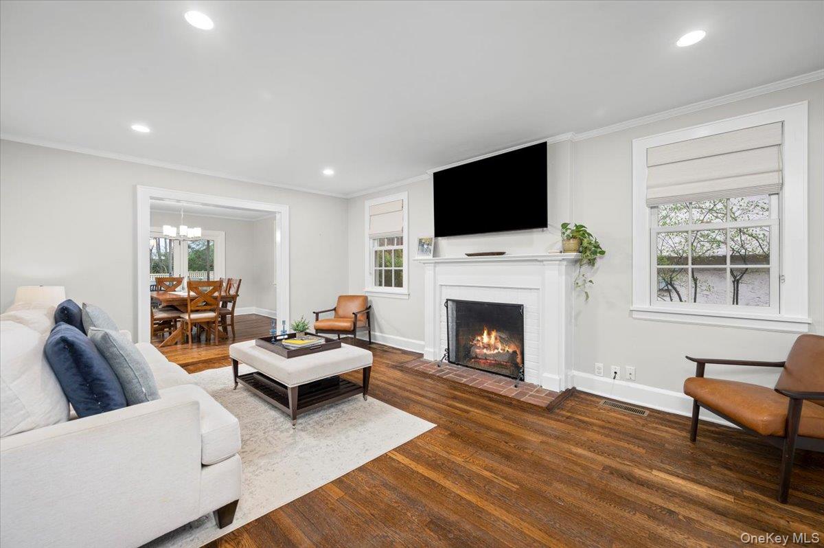 19 Nassau Road Larchmont, NY 10538 - Photo 6 of 40 a living room with furniture a flat screen tv and a fireplace