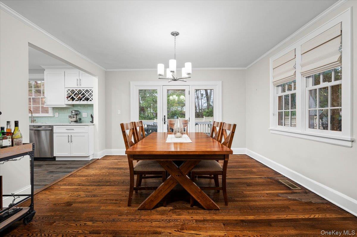 19 Nassau Road Larchmont, NY 10538 - Photo 8 of 40 a dining room with furniture a chandelier and wooden floor