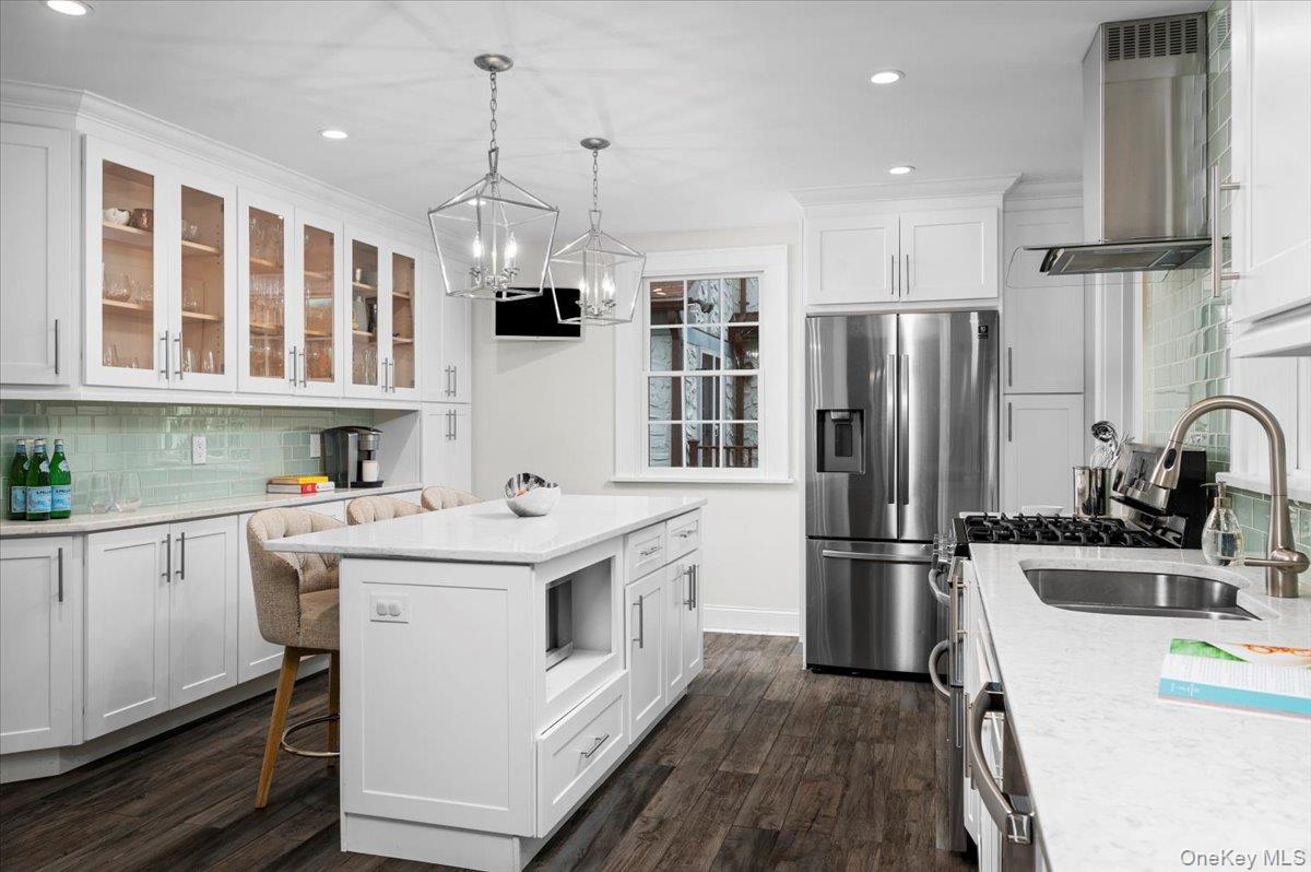 19 Nassau Road Larchmont, NY 10538 - Photo 9 of 40 a kitchen with a sink a refrigerator and cabinets