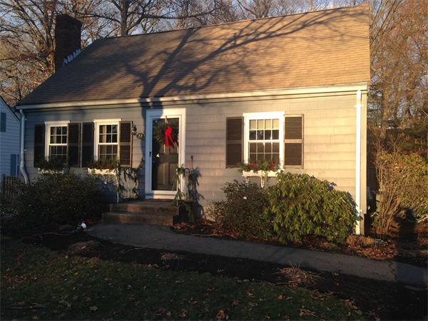 22 Louise Street Canton, MA 02021 - Photo 1 of 26 a front view of a house with garden