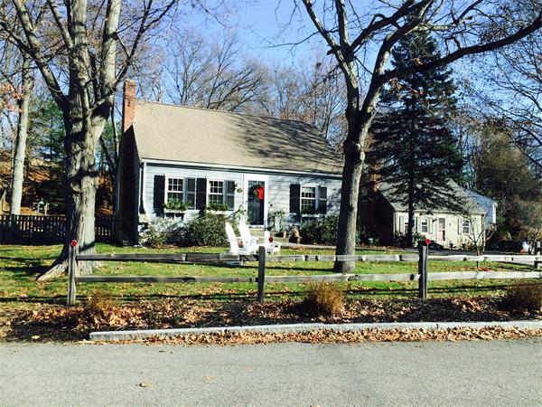 22 Louise Street Canton, MA 02021 - Photo 3 of 26 a front view of a house with a garden