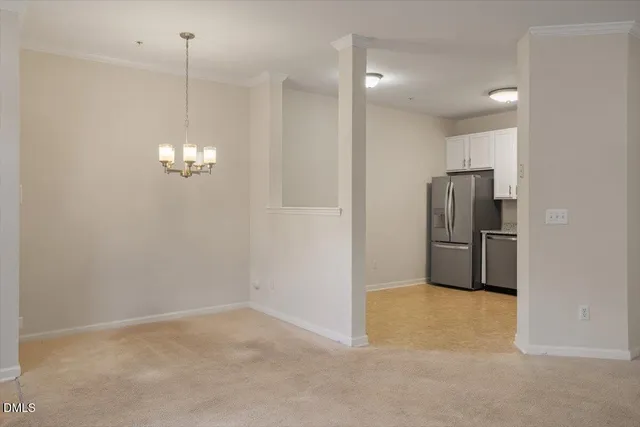 a view of a kitchen with a refrigerator a sink and dishwasher