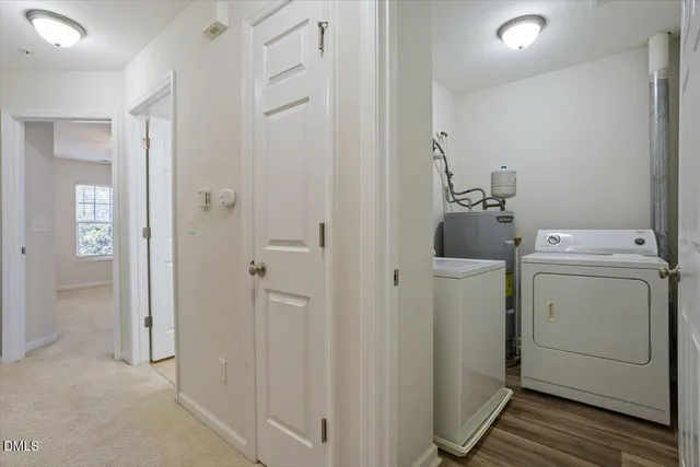 a view of bathroom with a washer and dryer