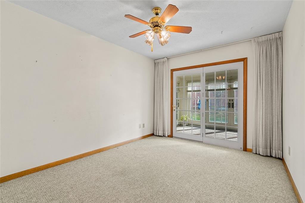 105 Teakwood Road Butler, PA 16001 - Photo 13 of 22 an empty room with chandelier fan