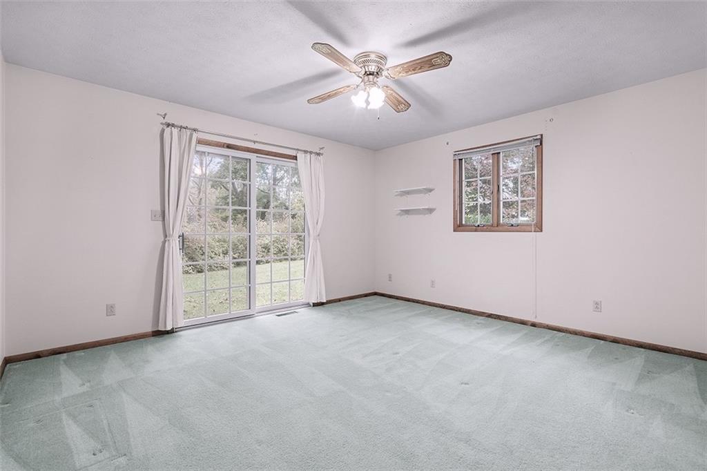 105 Teakwood Road Butler, PA 16001 - Photo 19 of 22 an empty room with windows and fan