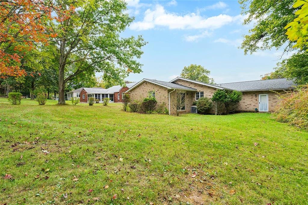 105 Teakwood Road Butler, PA 16001 - Photo 4 of 22 a front view of a house with garden