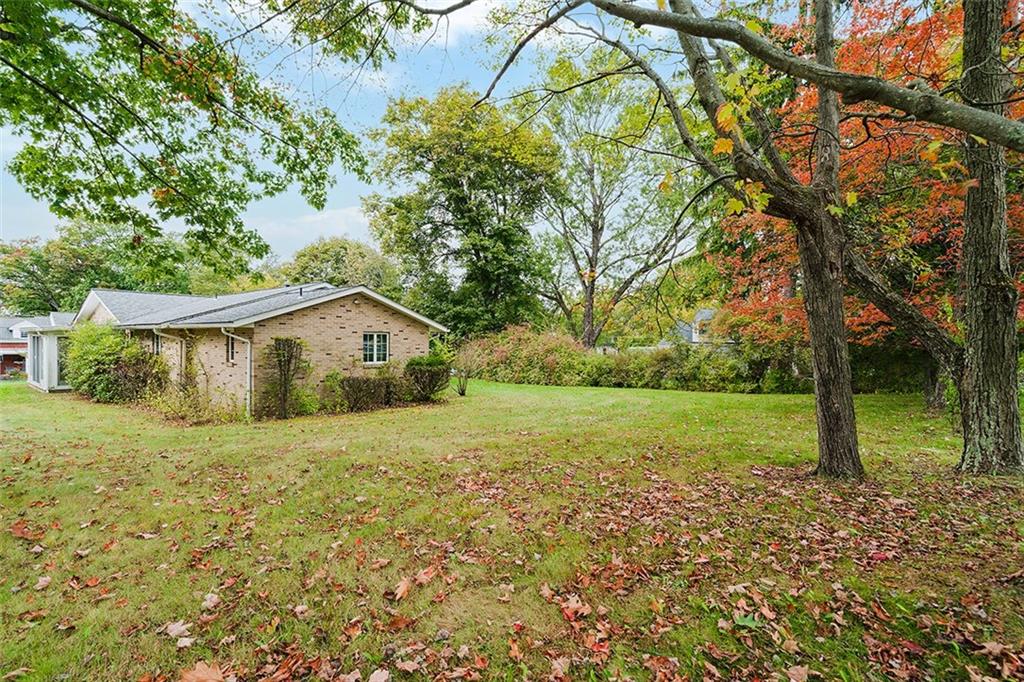 105 Teakwood Road Butler, PA 16001 - Photo 5 of 22 a view of a house with a yard and large trees