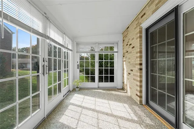 a view of empty room with windows