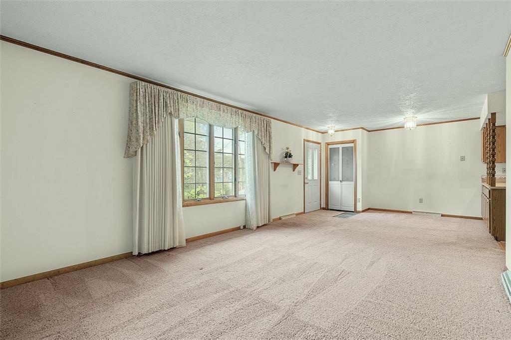 105 Teakwood Road Butler, PA 16001 - Photo 8 of 22 a view of an empty room with a window