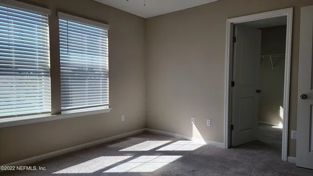 a view of an empty room and window