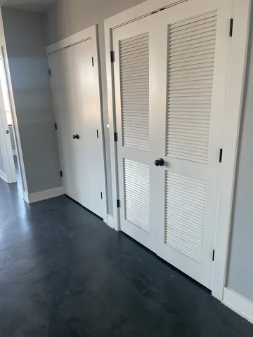 an empty room with wooden floor