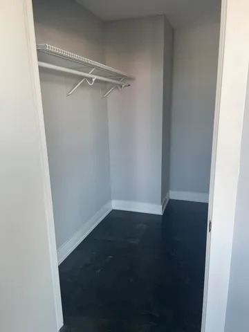 a view of an empty walk in closet