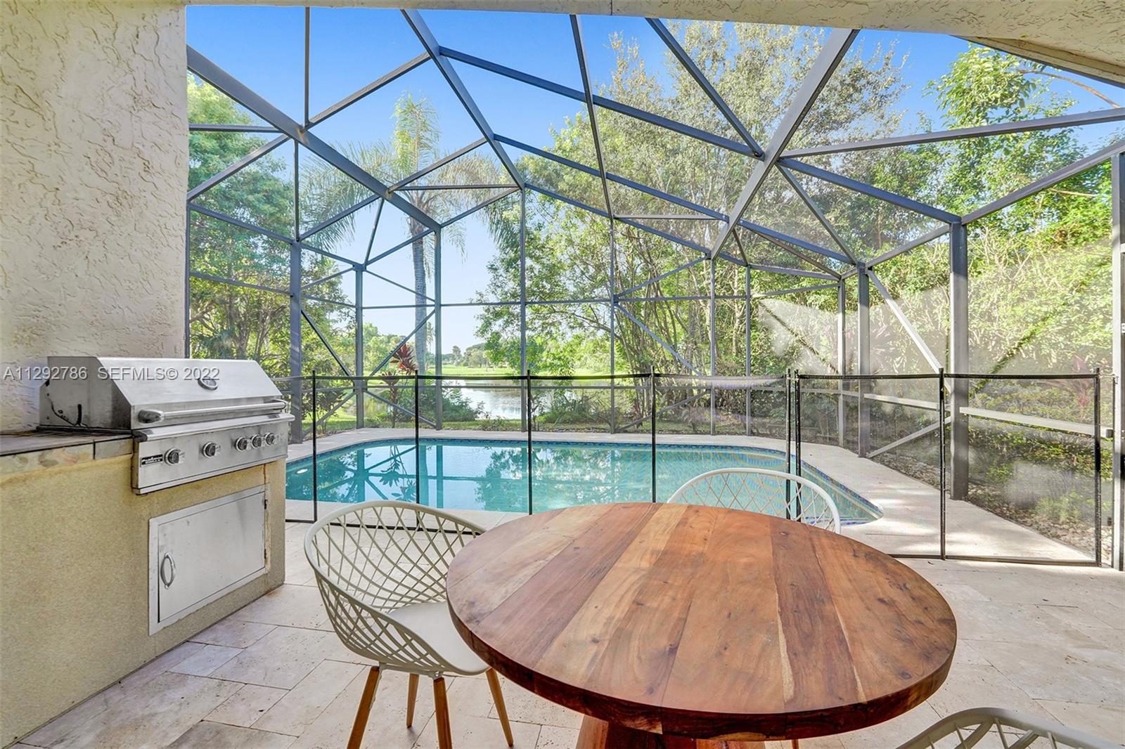 10150 Camelback Lane Boca Raton, FL 33498 - Photo 43 of 67 Screened-in pool