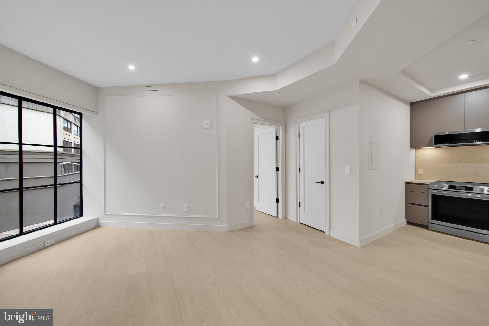 2121 Ward Place Northwest, Unit 401 Washington, DC 20037 - Photo 11 of 21 a view of an empty room with a window